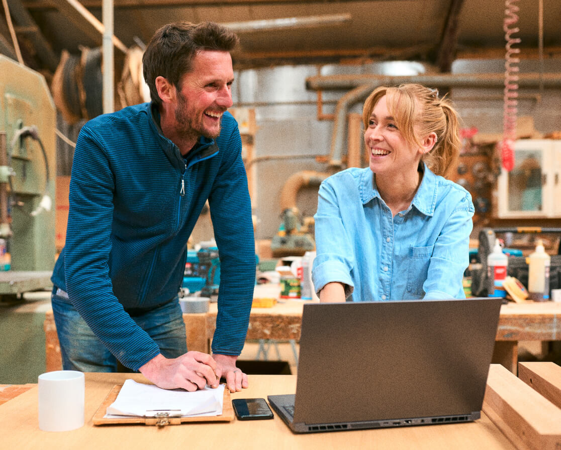 two employers smiling at one another