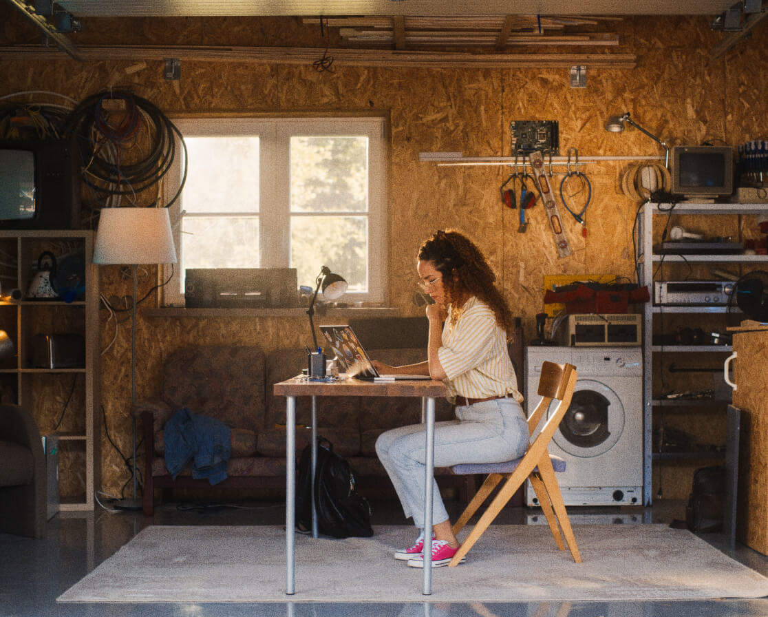 woman sitting at desk on laptop